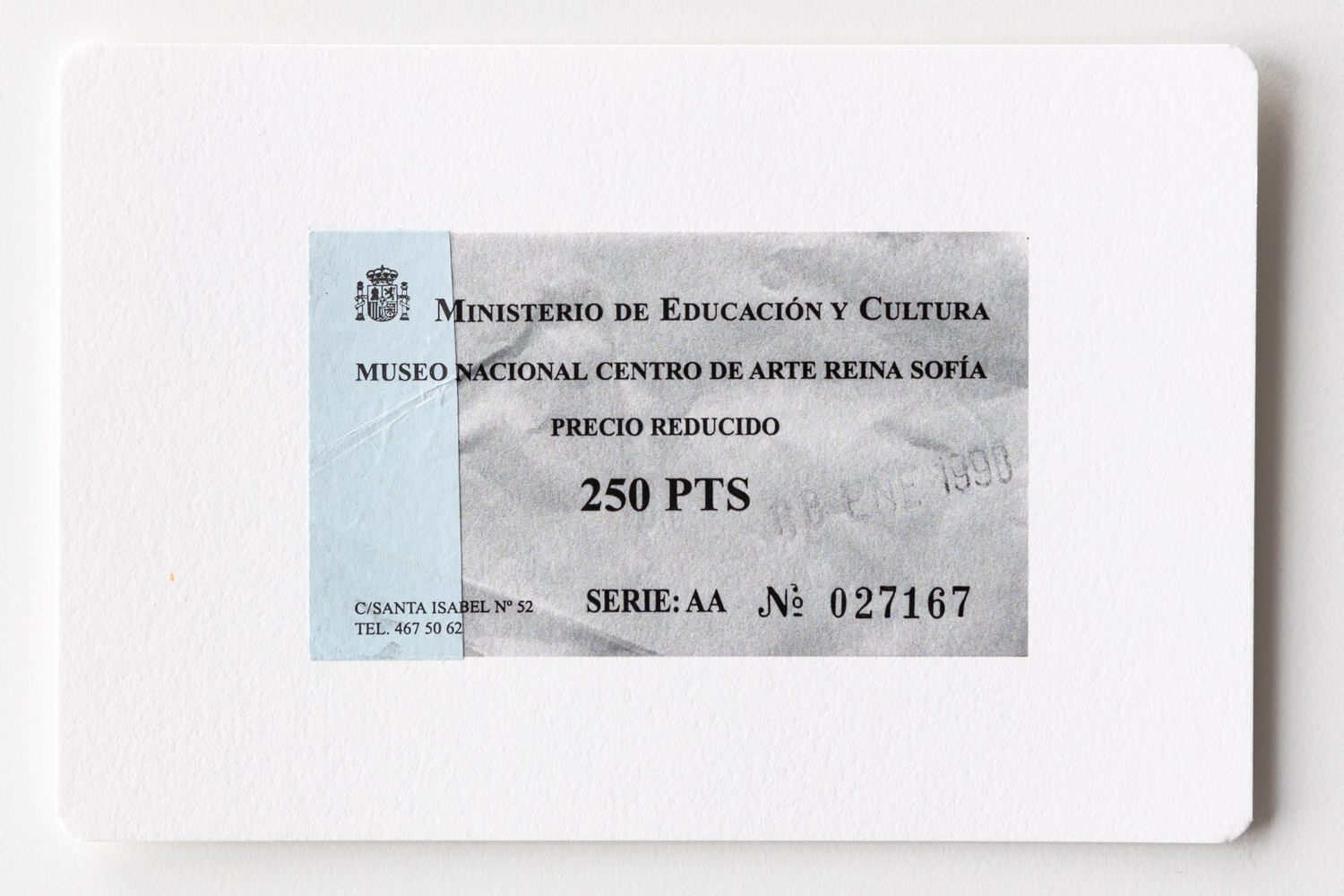 Postcard with a b/w-print of an admission ticket and a blue paper strip of the original ticket glued on.
